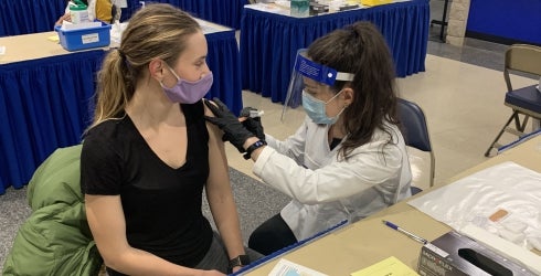 PAS Student administering a vaccine